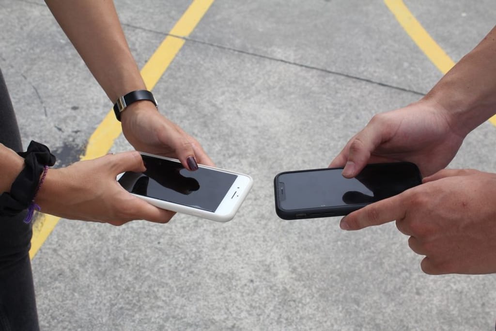 couple comparing phone plans